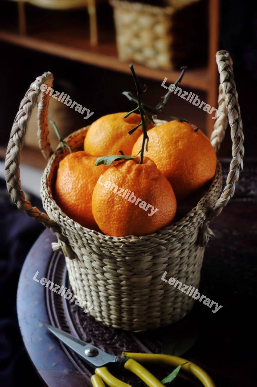 Tangerines inside a basket